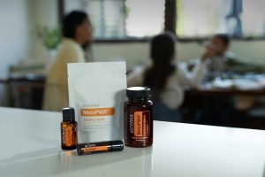 A selection of essential oil products displayed indoors, focused on wellness.
